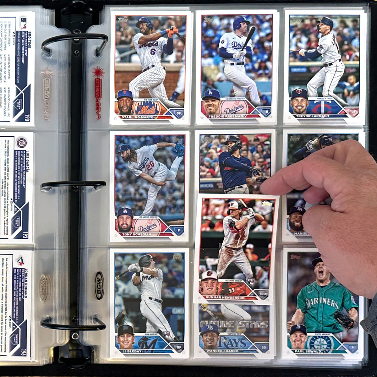 BCW 9-pocket pages shown in binder